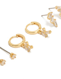Featuring dainty cross cubic zirconia baguette trio studs and huggie earrings in a gold plated 3-pack close up view - link has visual effect only