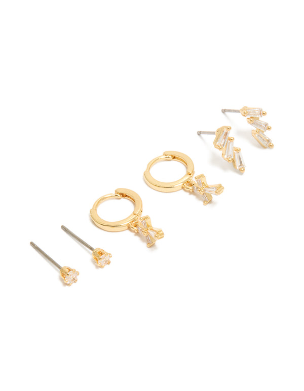 Showcasing dainty cross cubic zirconia baguette trio studs and huggie earrings in a gold plated 3-pack front view