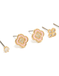 Featuring gold plated cubic zirconia flower stud earrings in a 3-pack and crystal accents close up view - link has visual effect only