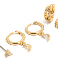 Showcasing a dainty huggie earrings 3-pack with cubic zirconia and crystal featuring gold plated material in gold color close up view - link has visual effect only