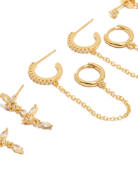 Highlighting gold plated butterfly and chain earrings in a 4-pack, cubic zirconia stones, crystal embellishments, and huggie closures close up view - link has visual effect only