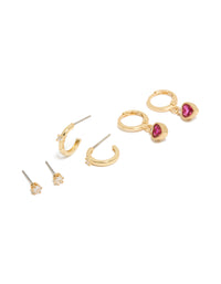 Showcasing gold plated cubic zirconia studs and heart huggie earrings with charm featuring crystal closure hoop in a 3-pack set front view - link has visual effect only