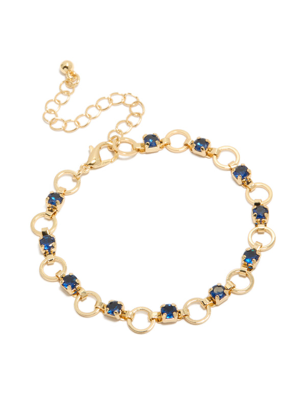 Elegant gold plated bracelet featuring blue cubic zirconia in round cut with alternating link design front view