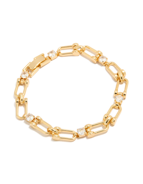 Showcasing a gold plated brass cubic zirconia bracelet in gold with statement and dainty styling front view