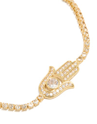 Showcasing a gold plated bracelet with hamsa hand and cubic zirconia stones in statement style close up view - link has visual effect only