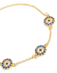 Stunning evil eye bracelet featuring gold plated metal with navy and clear details close up view - link has visual effect only
