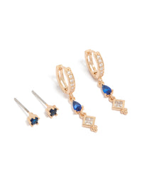 Featuring crystal and cubic zirconia details in huggie and stud closures, this 2-pack set showcases gold tones with royal blue and clear stones front view - link has visual effect only