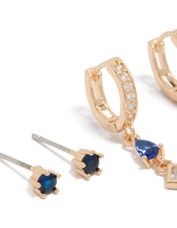Showcasing crystal and cubic zirconia details in huggie and stud closures, this 2-pack set highlights gold tones with royal blue and clear stones close up view