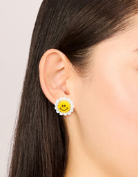 Featuring acrylic flower smiley face stud earrings with pearl accents in yellow and white on ear view - link has visual effect only
