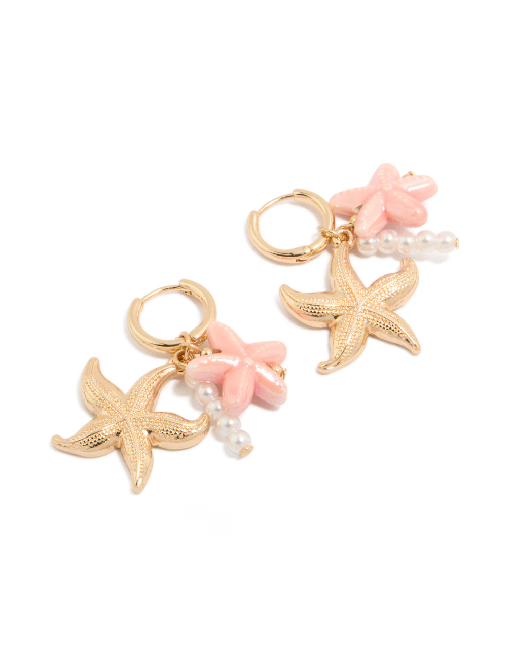 Discover dainty gold huggie earrings featuring pearl, pink flower, and starfish ocean theme charm drops in light pink and white front view