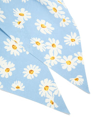 Crafted from sky blue fabric, this daisy printed scarf scrunchie features a floral print with white and yellow accents detail view - link has visual effect only