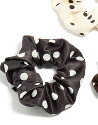 Featuring polka dot pattern scrunchies in a 3-pack with black, ivory, saddle brown, and white detail view - link has visual effect only