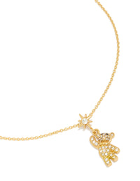 Showcasing a tweens pavé hanging bear necklace crafted from waterproof stainless steel with celestial charm featuring star and animal pendant in gold plated close up view - link has visual effect only