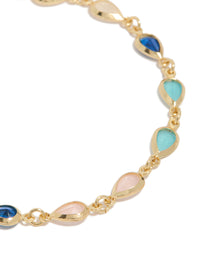Designed with gold plated bracelet showcasing pink and blue cubic zirconia stones in dainty style close up view - link has visual effect only