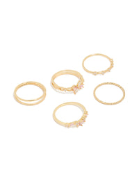 Showcasing a gold pink and clear cubic zirconia flower rings 5-pack with butterfly charm and floral crystal details front view - link has visual effect only