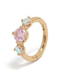 Featuring a gold plated surgical steel multi cubic zirconia circle clicker ring with crystal embellishments in pink and aquamarine tones detail view - link has visual effect only