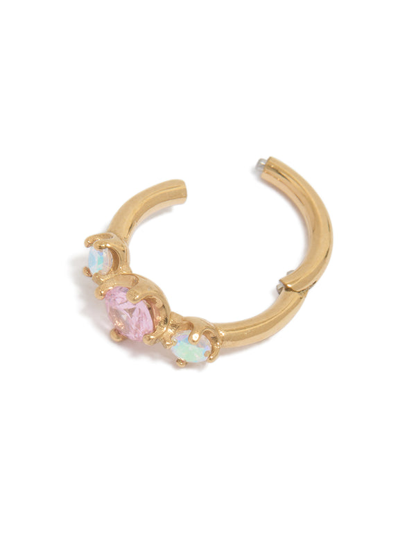 Featuring a gold plated surgical steel multi cubic zirconia circle clicker ring with crystal embellishments in pink and aquamarine tones detail view