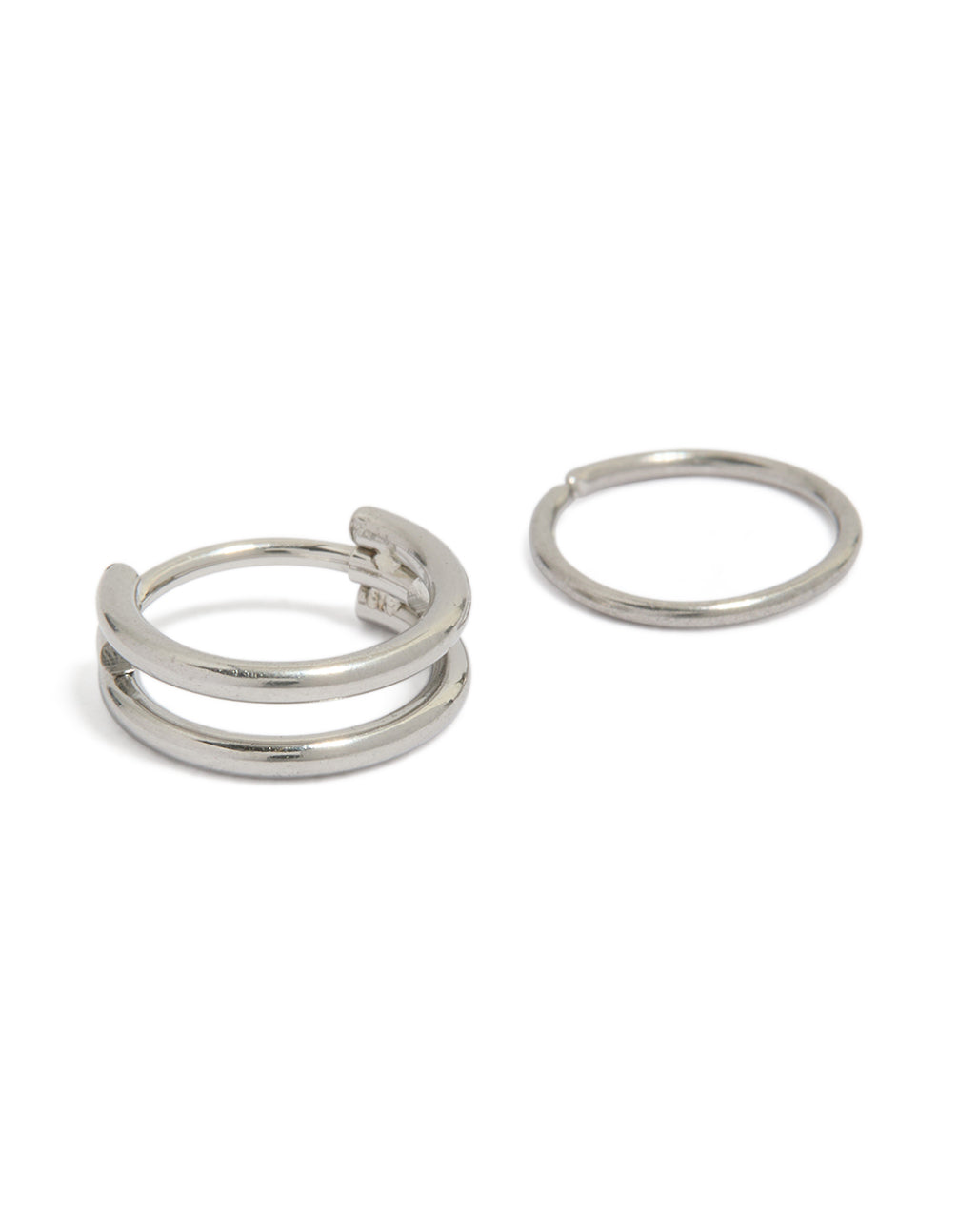 Featuring surgical steel double hinged and plain nose rings pack in silver detail view