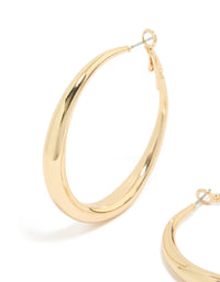 Featuring medium hoop earrings crafted from gold plated material with hoop closure close up view - link has visual effect only