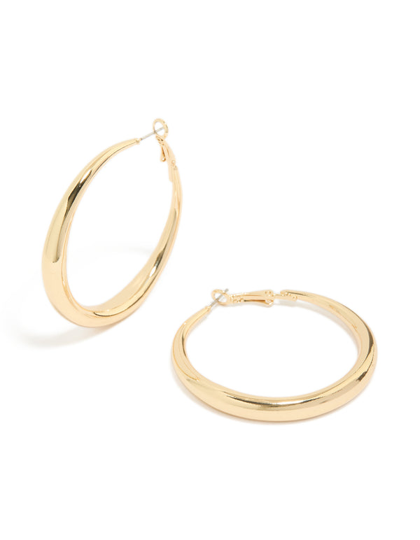 Showcasing medium hoop earrings with gold plated material and hoop closure in gold front view