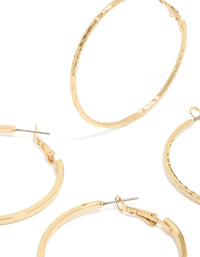 Showcasing gold plated smooth and textured hoop earrings in a 2-pack with hoop closure close up view - link has visual effect only