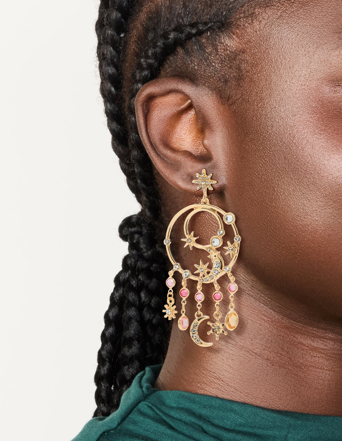 Showcasing gold pink and clear diamantes celestial circle drop earrings with statement style, featuring charm and star details in stud closure on ear view