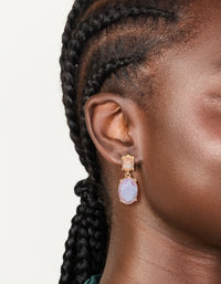 Featuring statement gold purple and orange diamantes double drop earrings on ear view - link has visual effect only