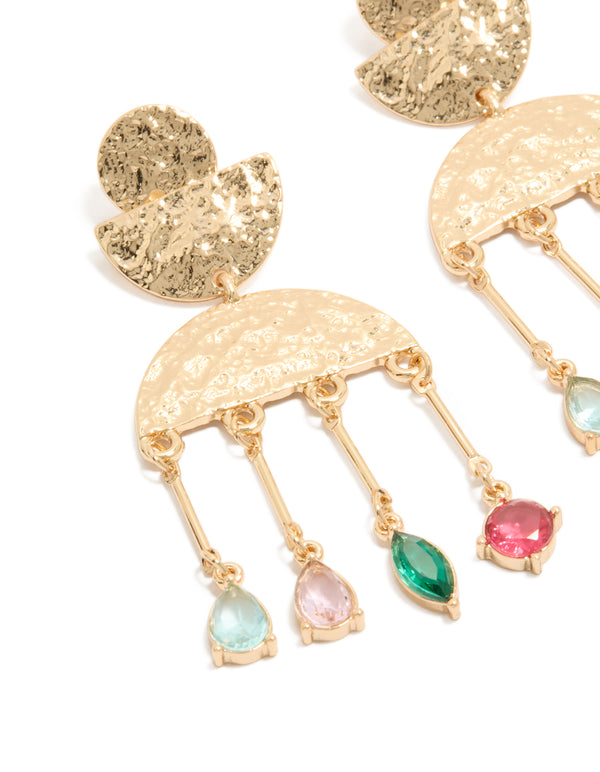 Beautifully crafted statement drop earrings with charm details in worn gold featuring pink and green diamantes close up view