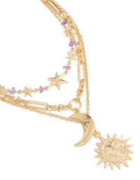 Showcasing a chunky gold purple stone and celestial pendant layered necklace with beads, charm featuring sun, moon and star close up view - link has visual effect only