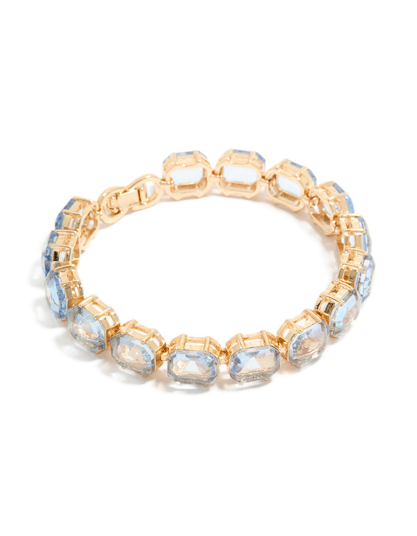 Showcasing a gold large light blue diamantes bracelet front view