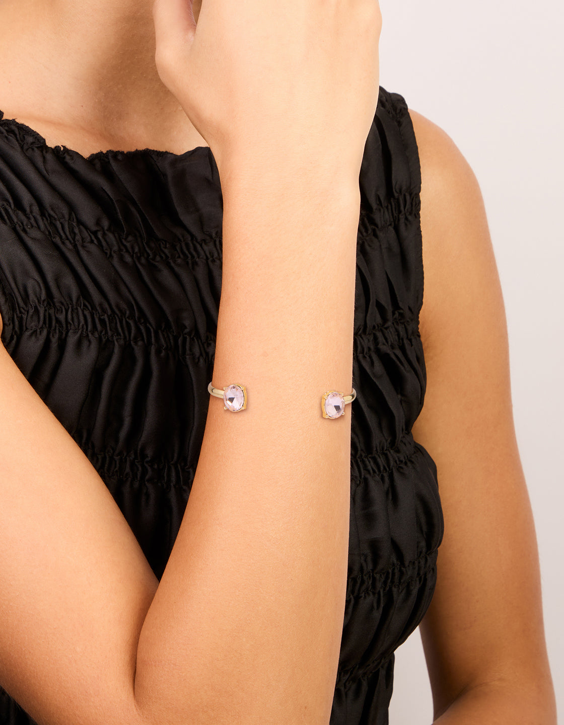 Crafted from gold, these pink and purple diamante wrist cuff bracelets in a 2-pack on wrist view
