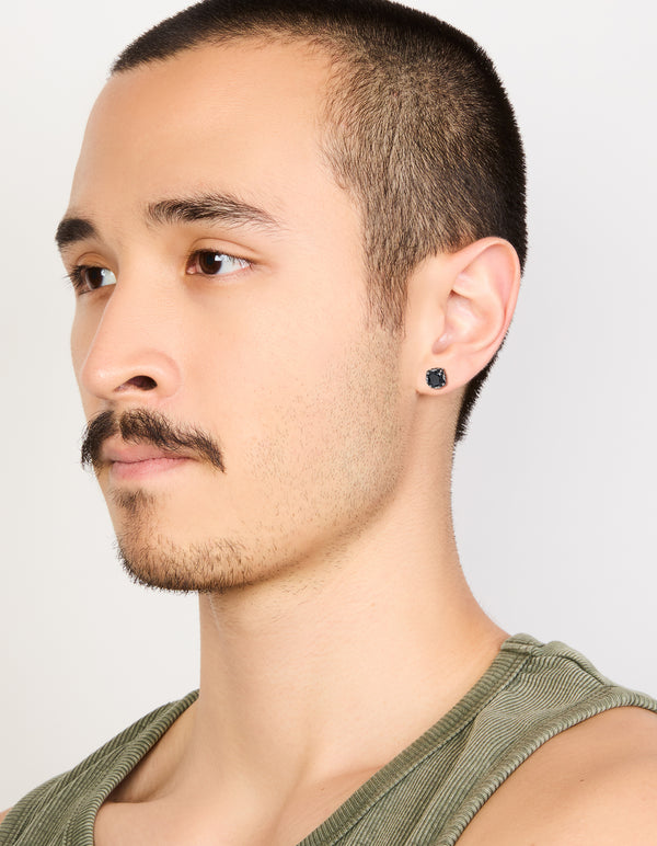 Featuring waterproof stainless steel mens black cubic zirconia flat back stud earrings on model view