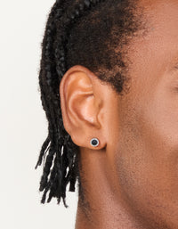 Featuring waterproof black coated stainless steel round flat back studs in silver on ear view - link has visual effect only