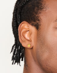 Showcasing mens waterproof gold plated stainless steel round flat back studs on ear view - link has visual effect only