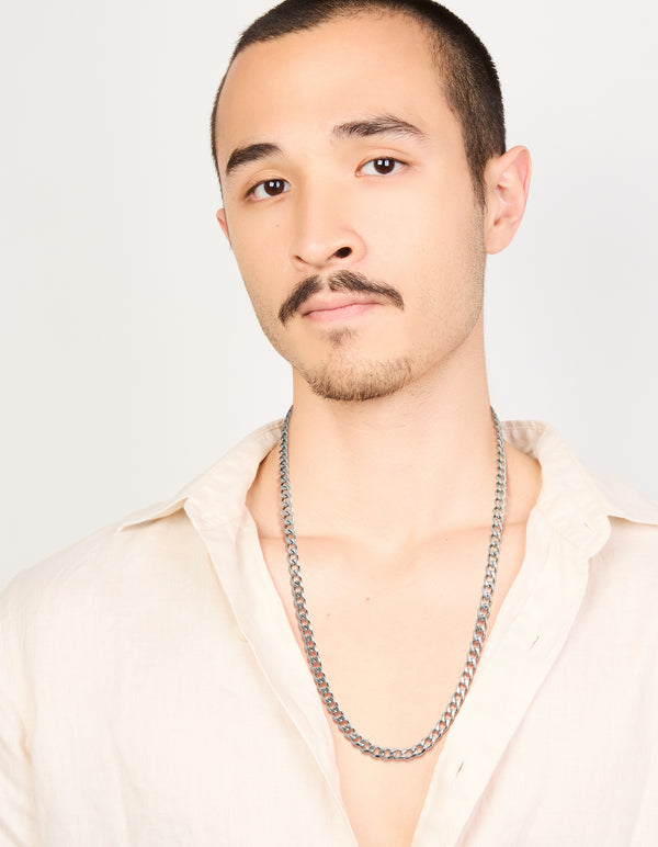 Displayed as a mens waterproof stainless steel classic curb link necklace in silver on model view