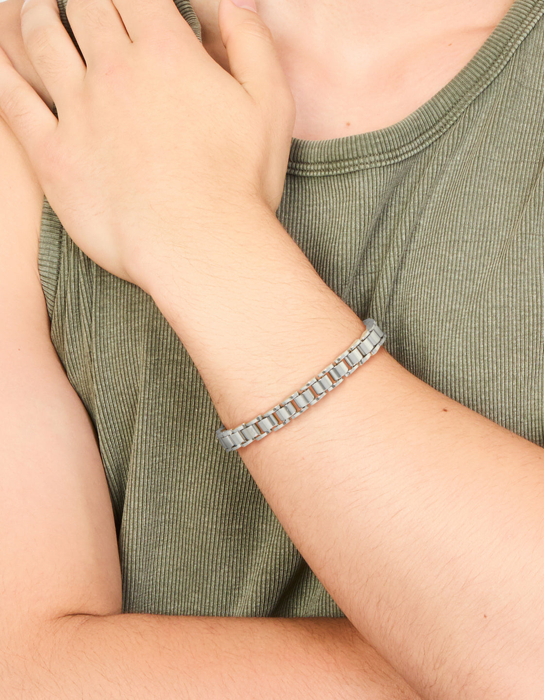 Featuring waterproof stainless steel construction, this mens link chain bracelet in silver on wrist view