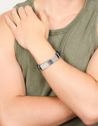 Featuring a mens waterproof bar bracelet with stainless steel and braided black PU leather band on wrist view - link has visual effect only