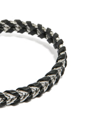 Designed with waterproof stainless steel and black PU leather, this mens braided chain bracelet in silver close up view - link has visual effect only