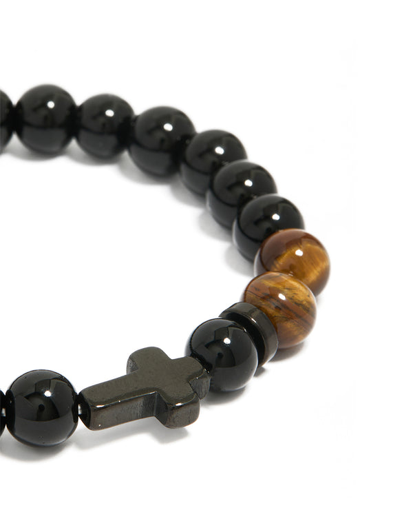 Crafted from waterproof black coated stainless steel with beaded design, tigers eye accents, and cross close up view
