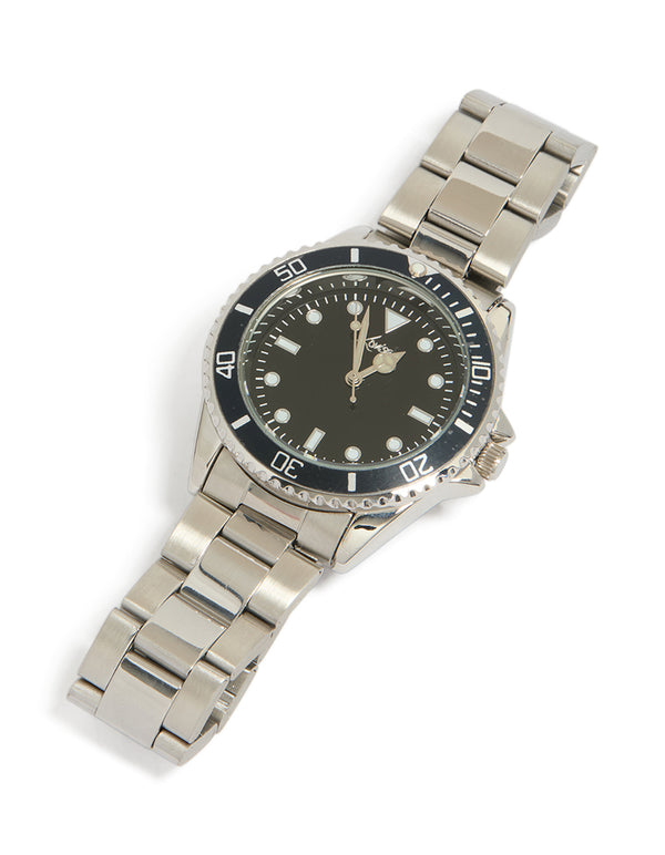 Showcasing a men's silver watch with numbers, black dial, round shape, formal occasion, link band strap, and analog type watch face detail view
