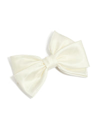 Featuring a bow solid ivory statement clip front view - link has visual effect only