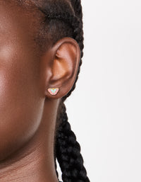 Featuring waterproof butterfly stud earrings crafted from gold plated stainless steel with multicoloured enamel in light pink, powder blue on ear view - link has visual effect only