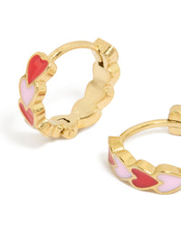 Designed with waterproof gold plated stainless steel red and pink enamel heart huggie earrings in coral close up view - link has visual effect only