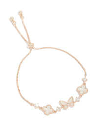 Showcasing a rose gold plated cubic zirconia alternating flower and butterfly charm toggle bracelet in ivory and clear front view - link has visual effect only