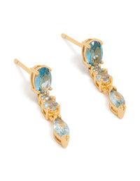 Showcasing statement gold plated light blue cubic zirconia trip drop earrings in aqua front view - link has visual effect only