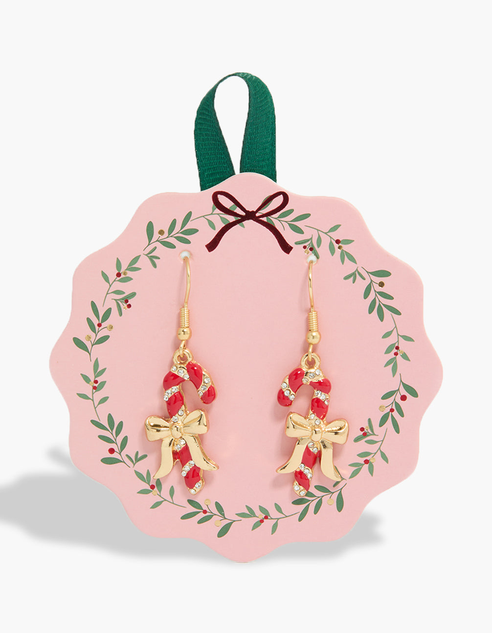 Showcasing chunky gold candy cane and bow earrings with festive food motif front view