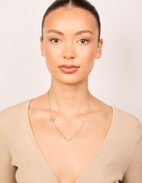 Elegantly displayed gold plated pink cubic zirconia flower trio necklace featuring floral in statement style on model view - link has visual effect only