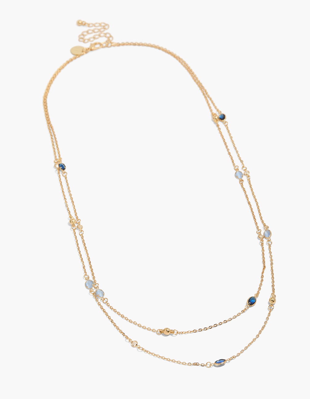 Discover a gold plated blue cubic zirconia long layered necklace featuring balls in dainty style front view