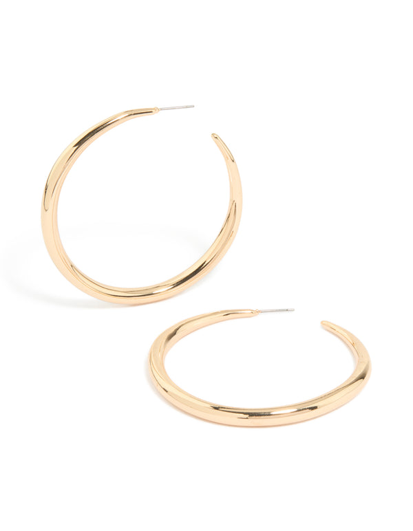 Showcasing gold thin plain hoop earrings with polished finish front view