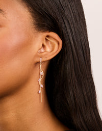 Featuring gold pink diamante swirl vine drop earrings on ear view - link has visual effect only